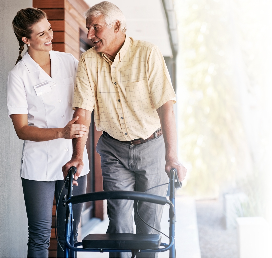 Nurse assisting patient with walker and smiling for some reason